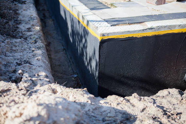 Professional Basement Waterproofing technician working in Hammondsport, NY